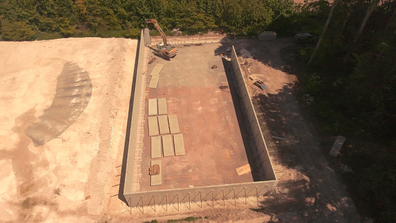 Aerial view of a rectangular excavated pit during groundworks