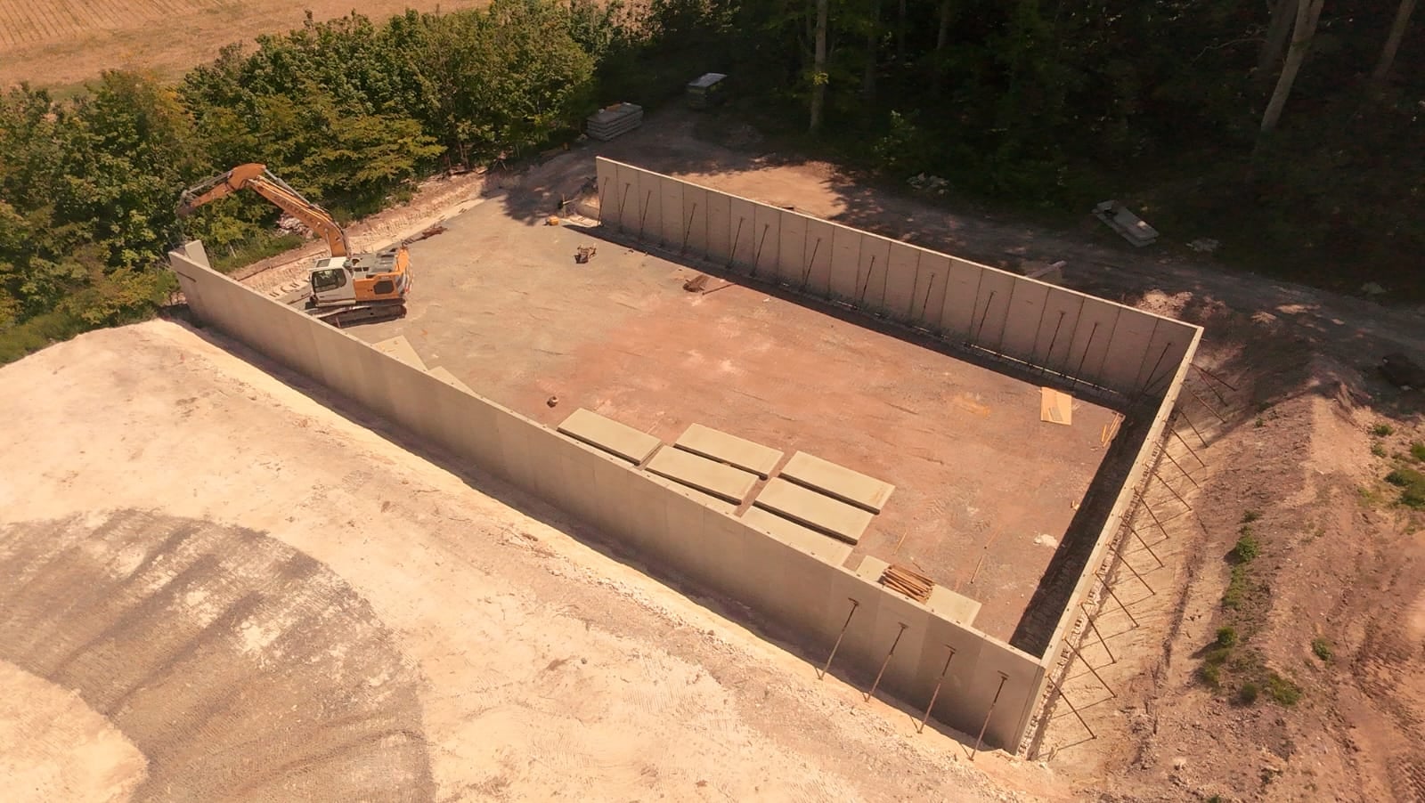 Aerial view of a rectangular pit with formwork shuttering in place ahead of a concrete pour