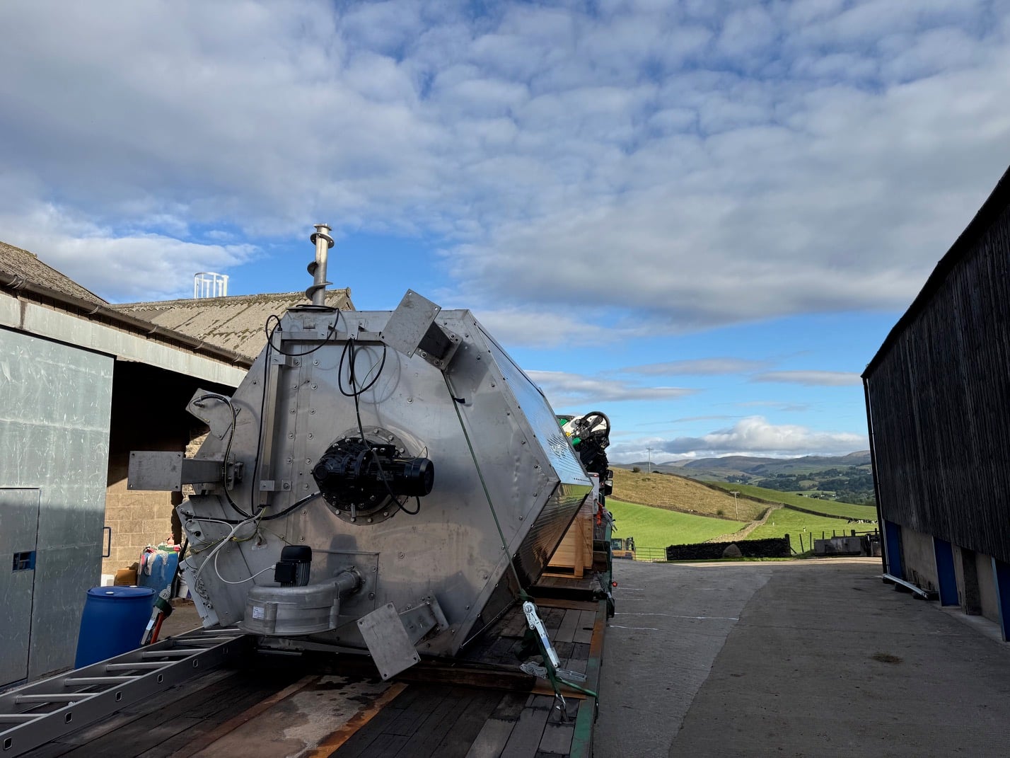 A mixer unit installed on the side of a digester tank, ready for operation