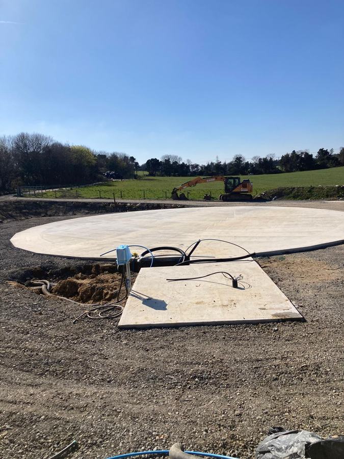 Service ducting and cabling installed through a prepared concrete pad ahead of plant installation